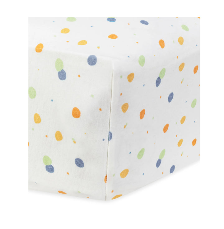 under the nile orgnaic cotton crib itted sheet with colorful dot pattern on a white background