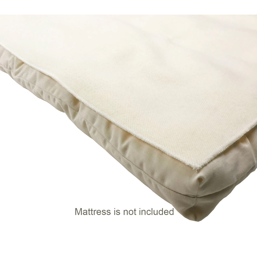 Wool mattress protector on a mattress