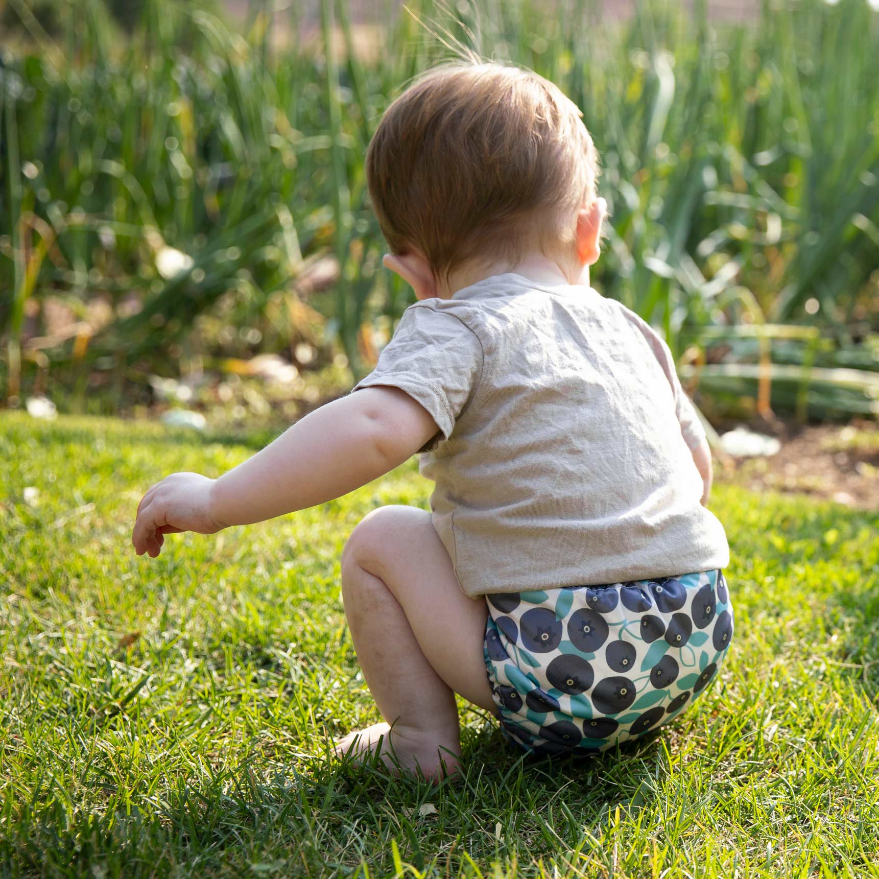 baby in Thirsties diaper outside