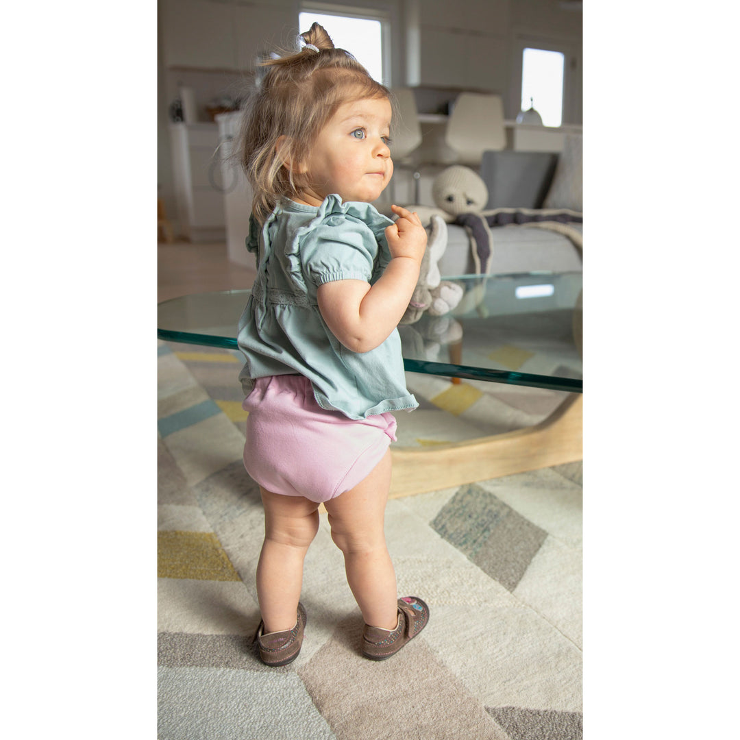 Thirsties crocus pink training pant on a toddler