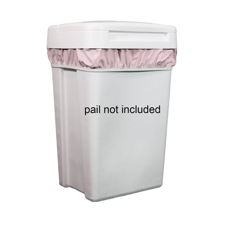 White trash bin with pink diaper pail liner and 'pail not included' text on a white background