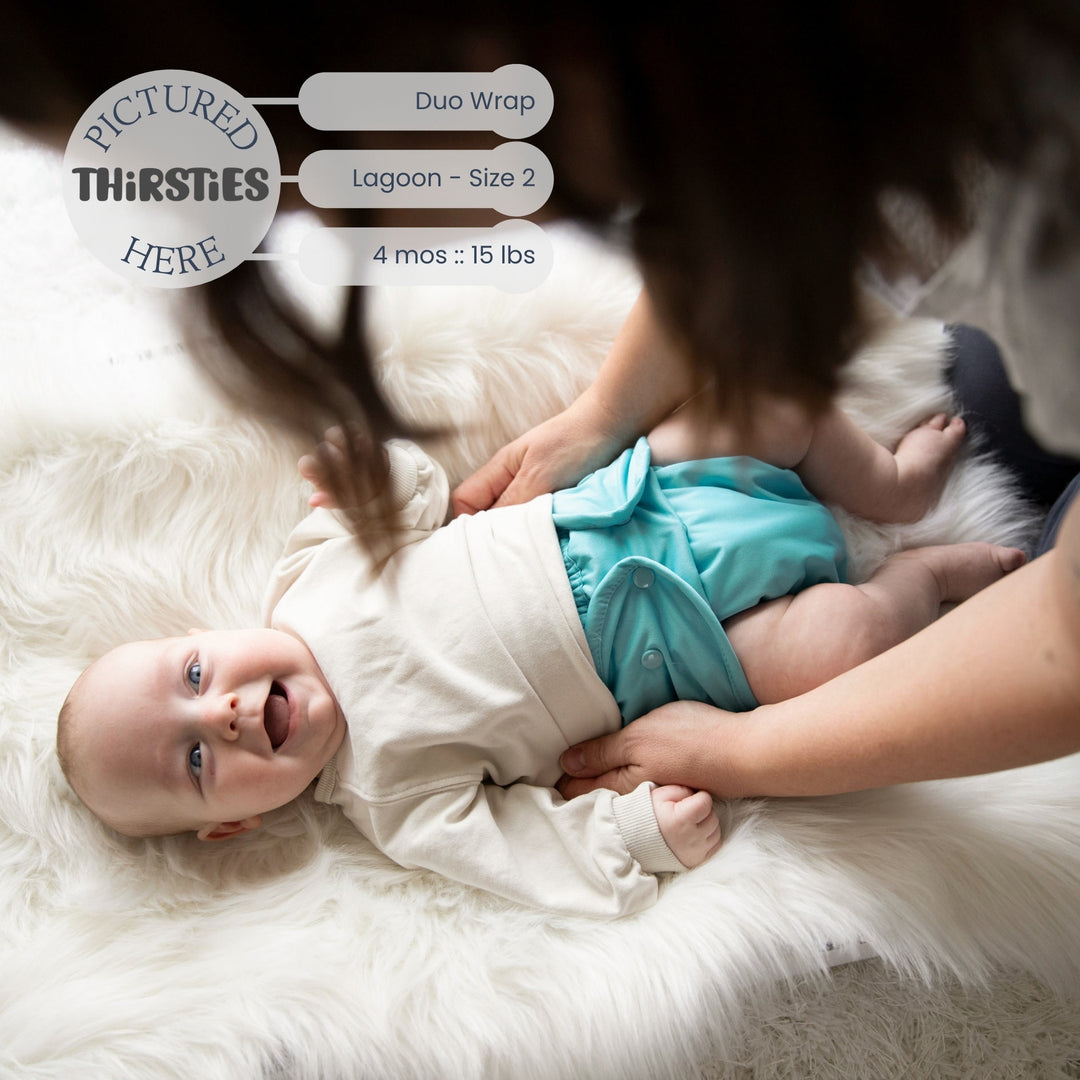 Baby in a Thirsties Duo wrap size 2