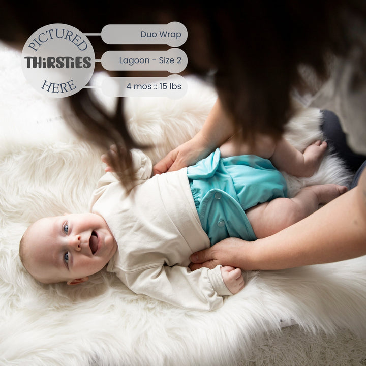 Baby in a Thirsties Duo wrap size 2