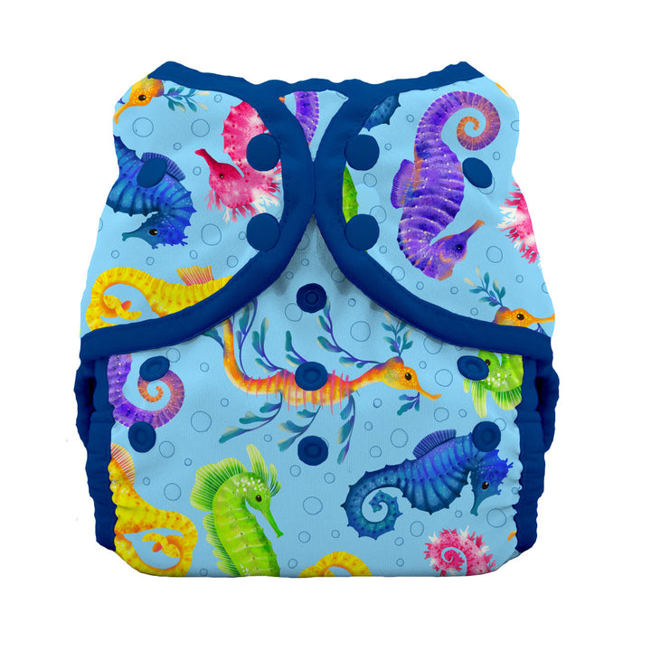 Colorful seahorse-patterned swim diaper on a white background