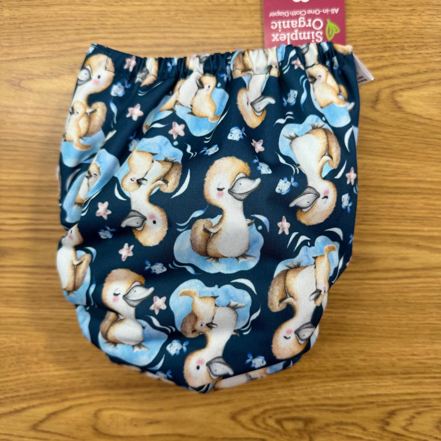 Blueberry simplex puggles duck print back of cloth diaper