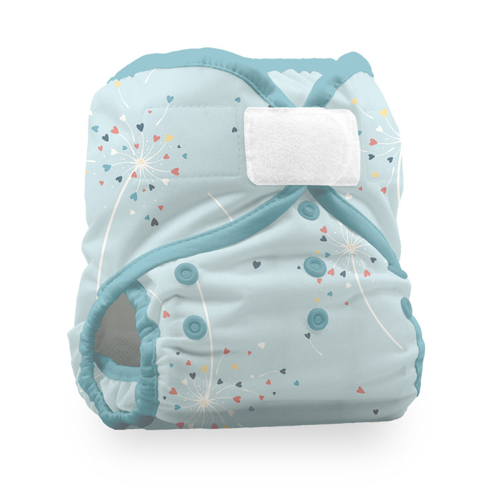 Thirsties Natural Pocket Diaper light blue reusable cloth diaper with a dandelion and confetti print, featuring a white hook-and-loop fastener Blowing Kisses print