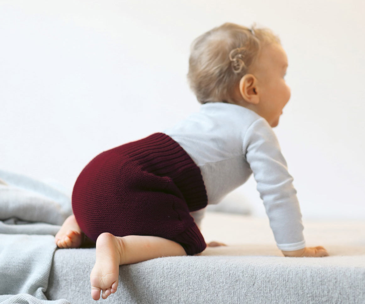 wool diaper cover on a baby