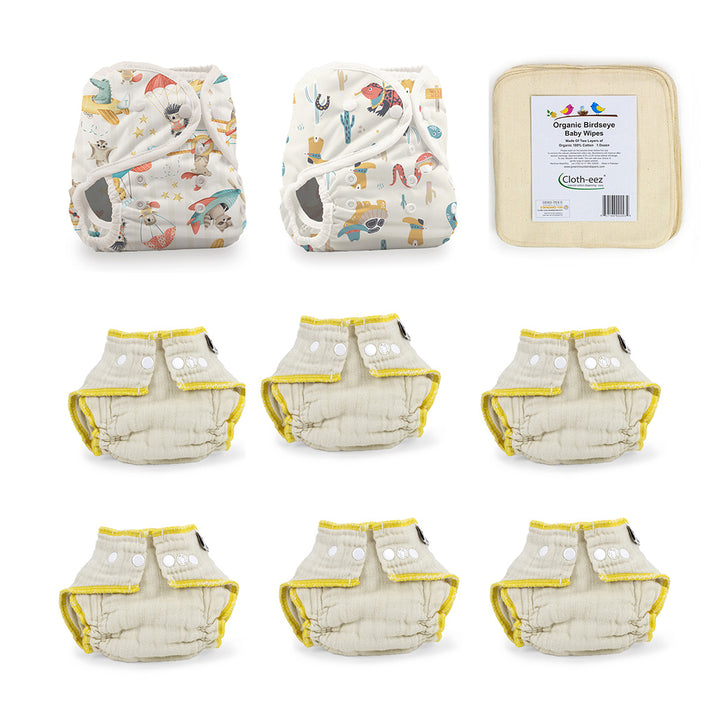 A set of reusable cloth diapers including two patterned diapers, six Workhorse organic fitted diapers size small and cloth wipes