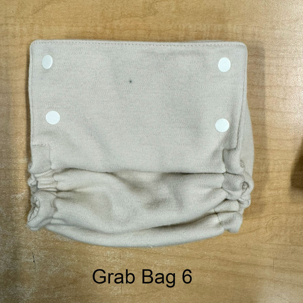 Babee Greens wool cover with small spot