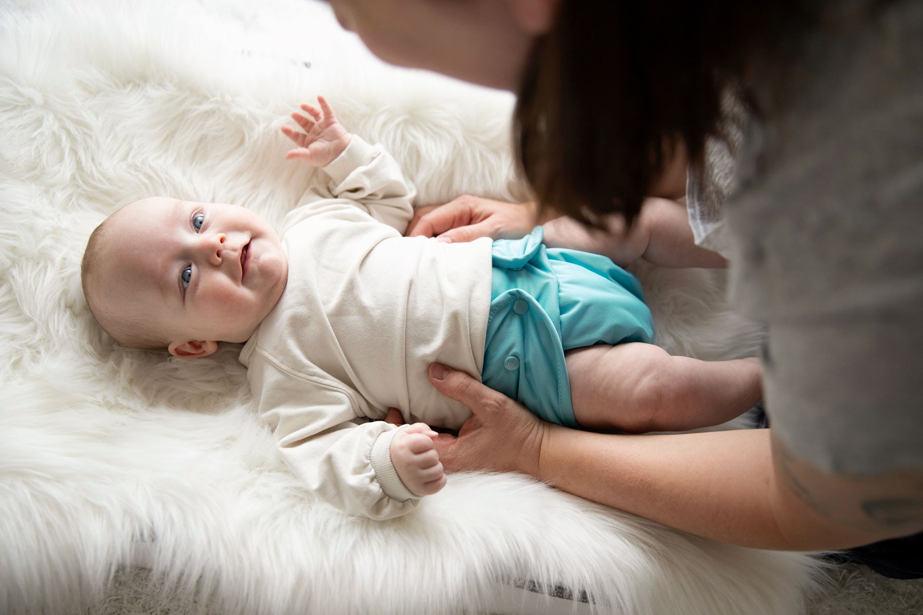 baby in Lagoon Thirsties Duo Wrap diaper cover