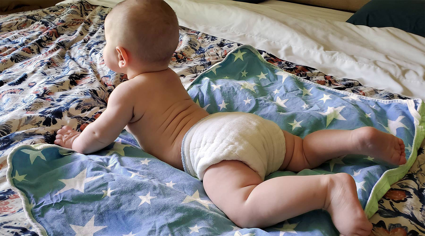 prefold cloth diaper on a baby