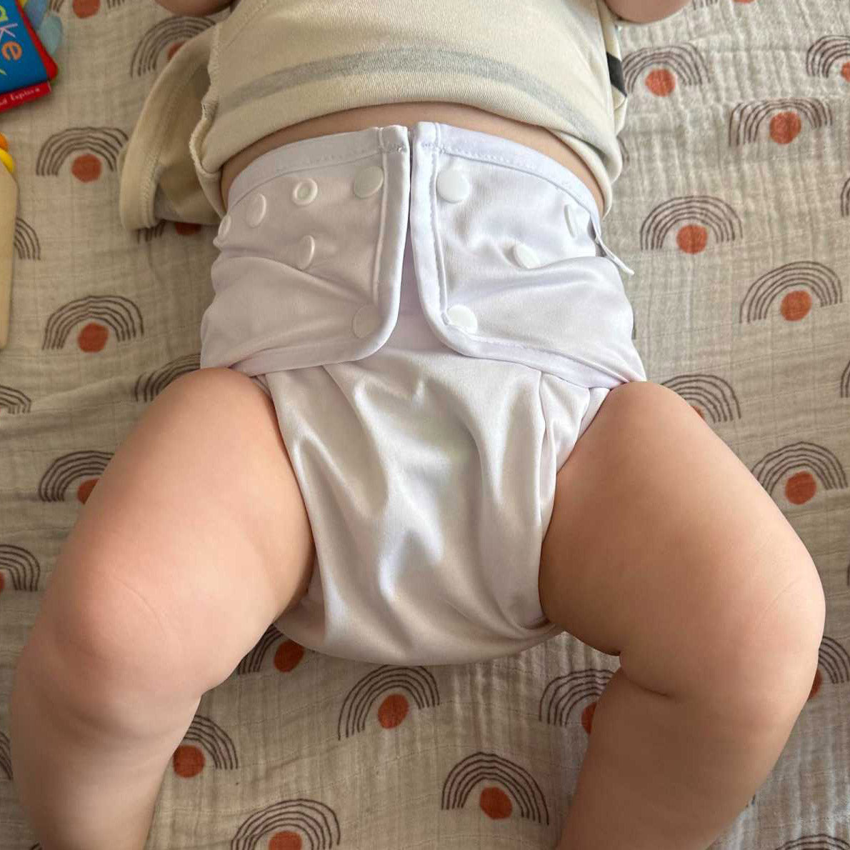 white diaper cover on a baby on sale
