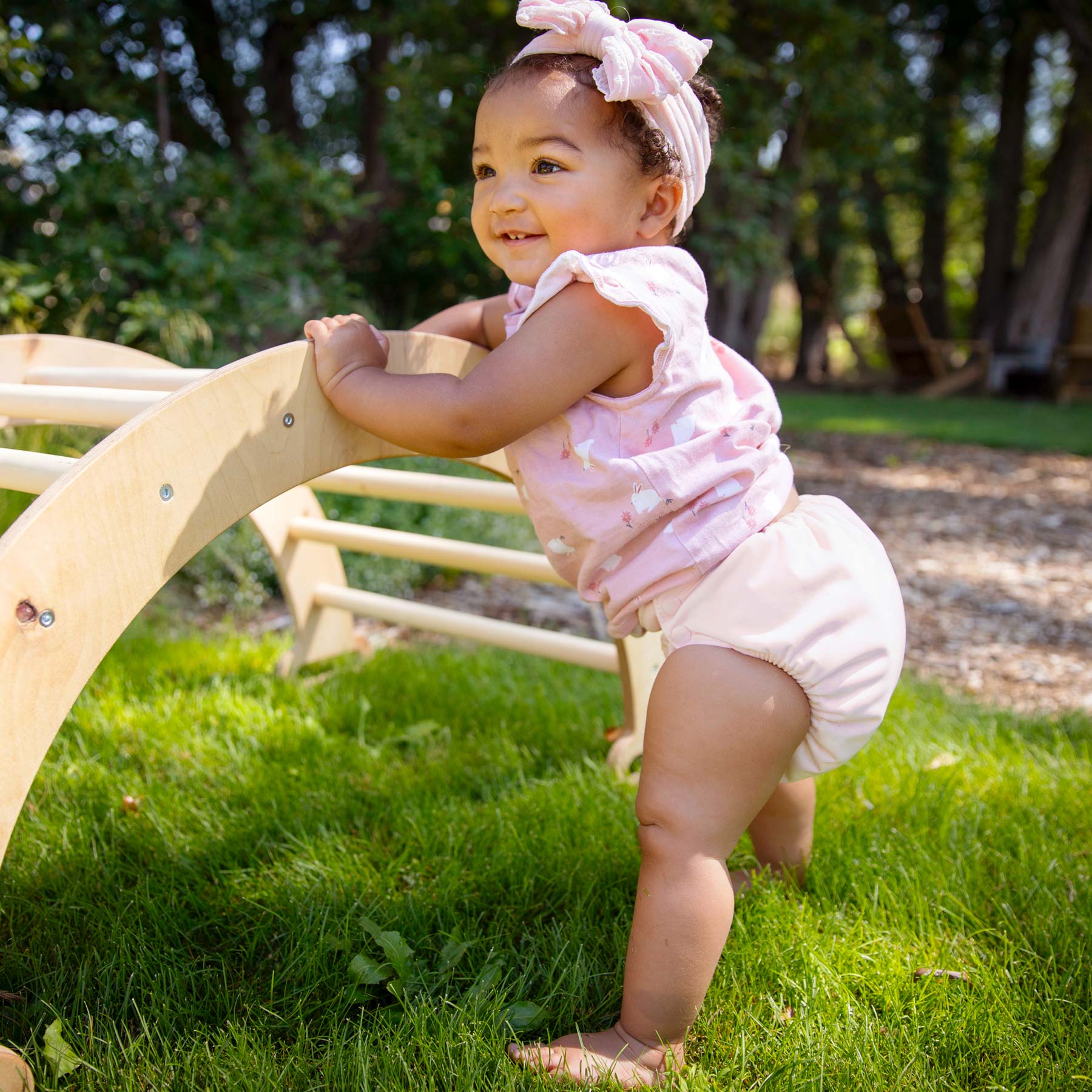 baby in Thirsties cloth diaper pink