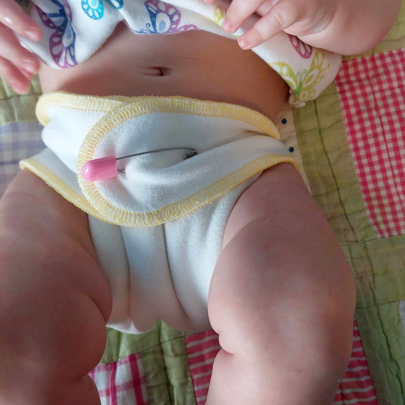 Cloth-eez preflat stretchy cloth diaper on a baby