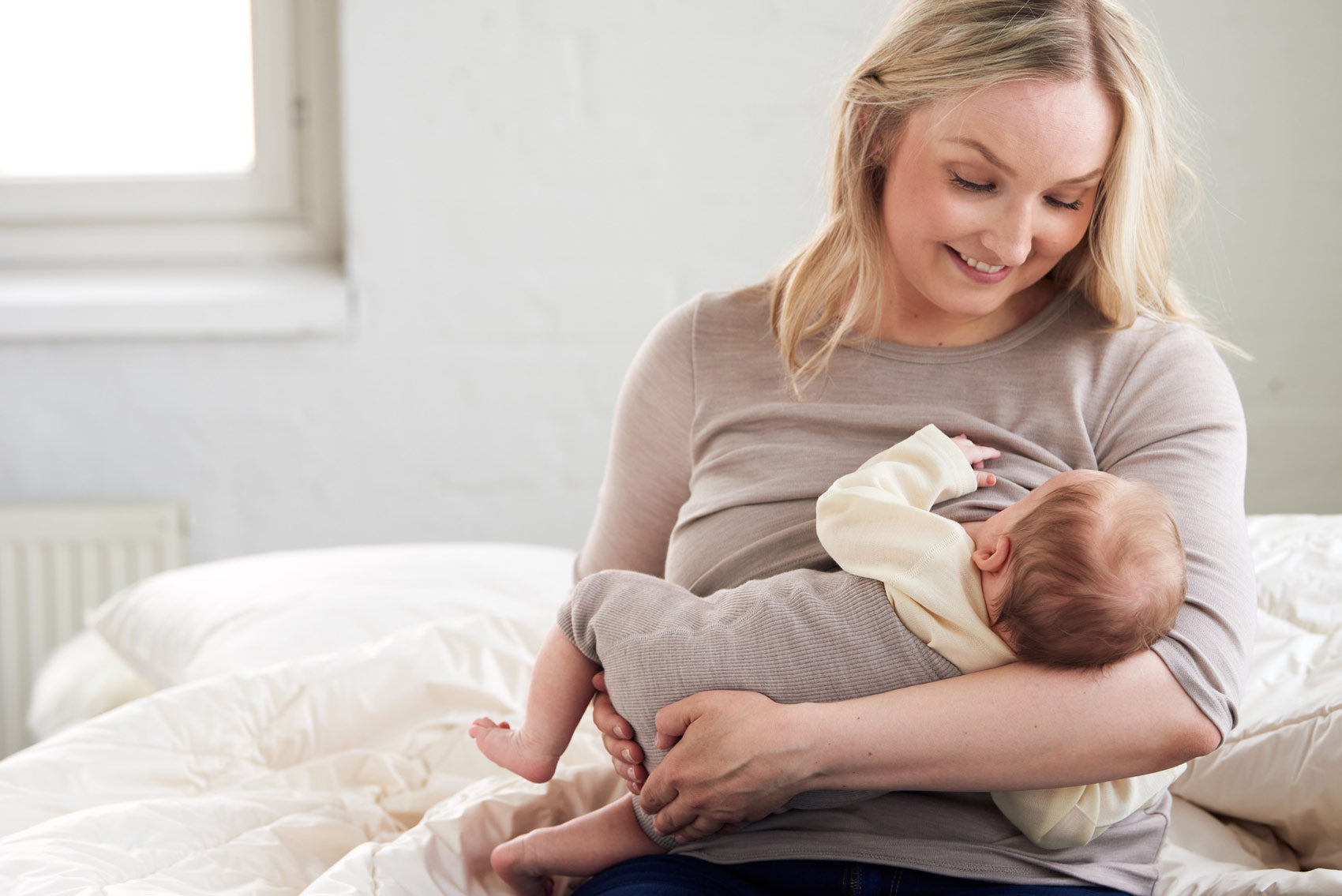 Ruskovilla wool diaper cover on a baby nursing 