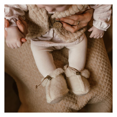 baby in wool booties