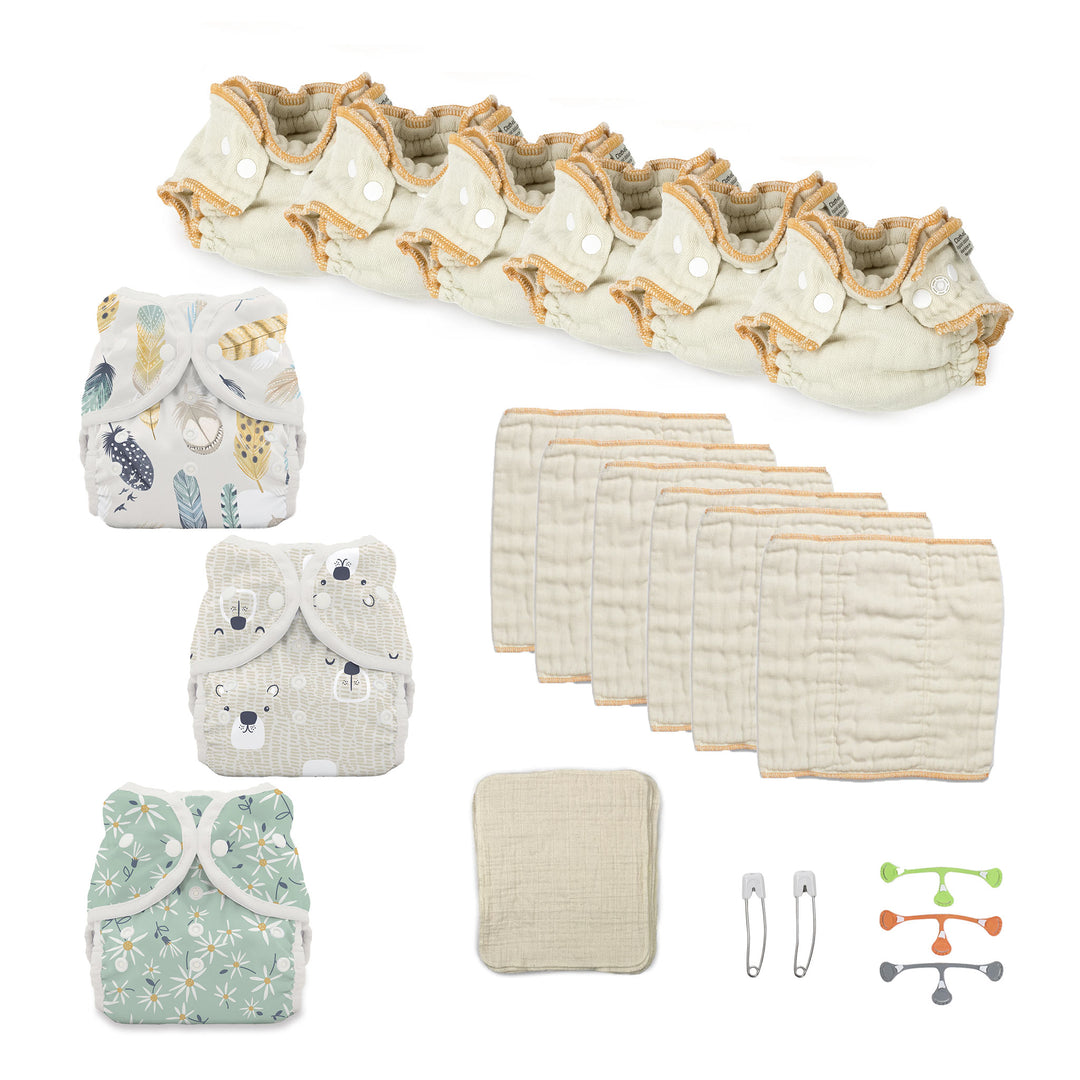 Newborn try both cloth diapers kit with fitteds and prefolds and diaper covers for a girl prints