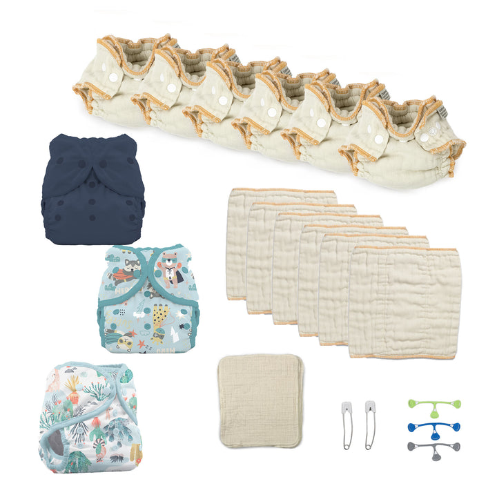 Newborn baby boy cloth diaper kit with fitted diapers, prefolds and three blue diaper covers wipes and pins navy super hero and desert dunes and a snappi fastener