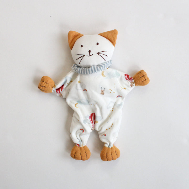 Stuffed toy cat with a patterned scarf on a white background made of organic cotton