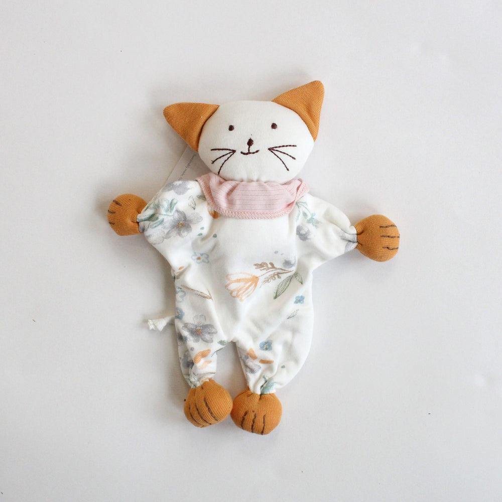 Stuffed toy cat with a pink scarf on a white background made of organic cotton