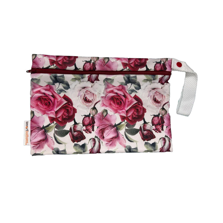 Floral-patterned cloth diaper wipes bag with a red zipper on a white background Moira