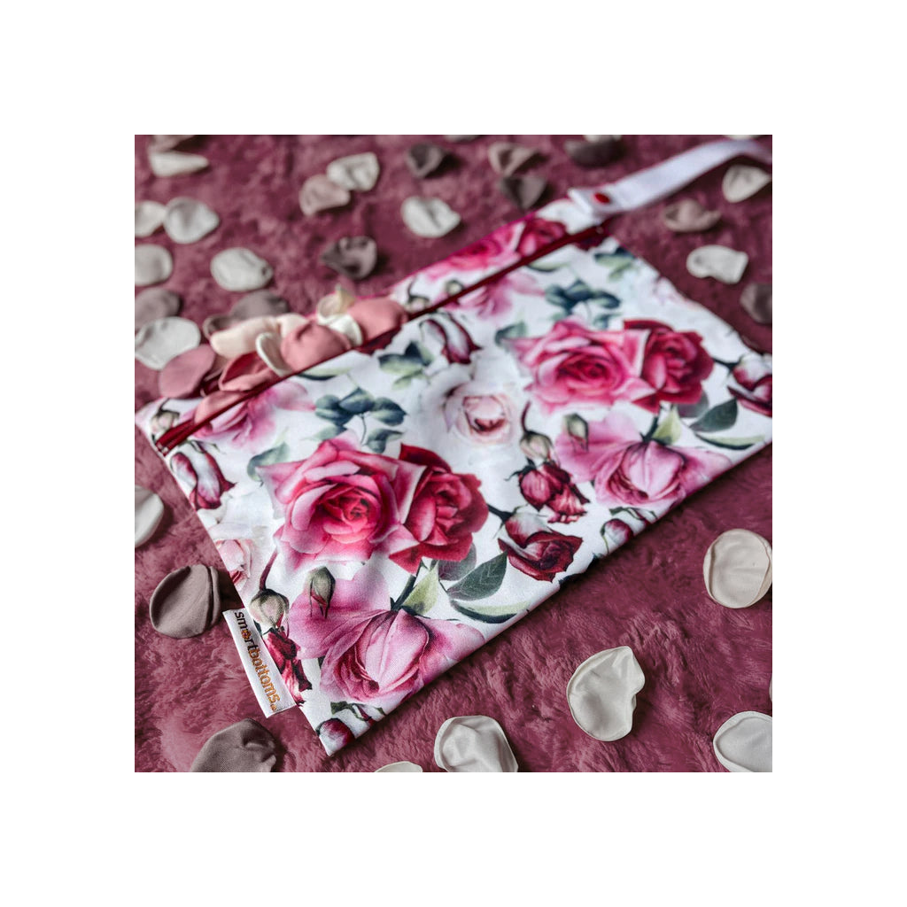 Floral fabric with pink roses on a pink background moira