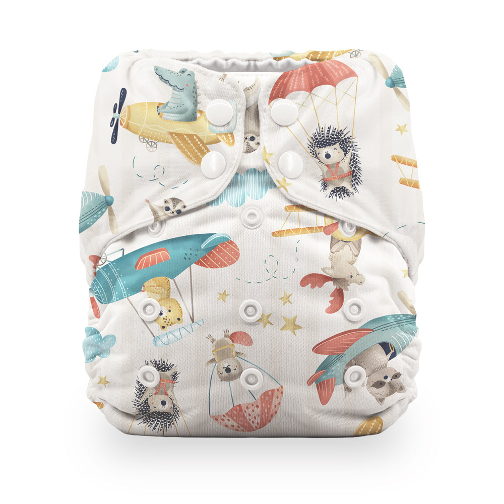 Thirsties reusable cloth baby diaper with an all-over whimsical animal and hot air balloon print on a warm off-white background, white snap closures Oh Chute print