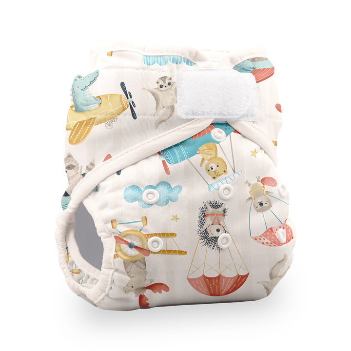 Thirsties Natural cotton pocket reusable cloth diaper with a whimsical animal and travel-themed print hook and loop closure
