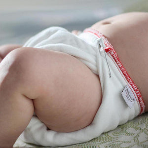 prefold cloth diaper on a baby