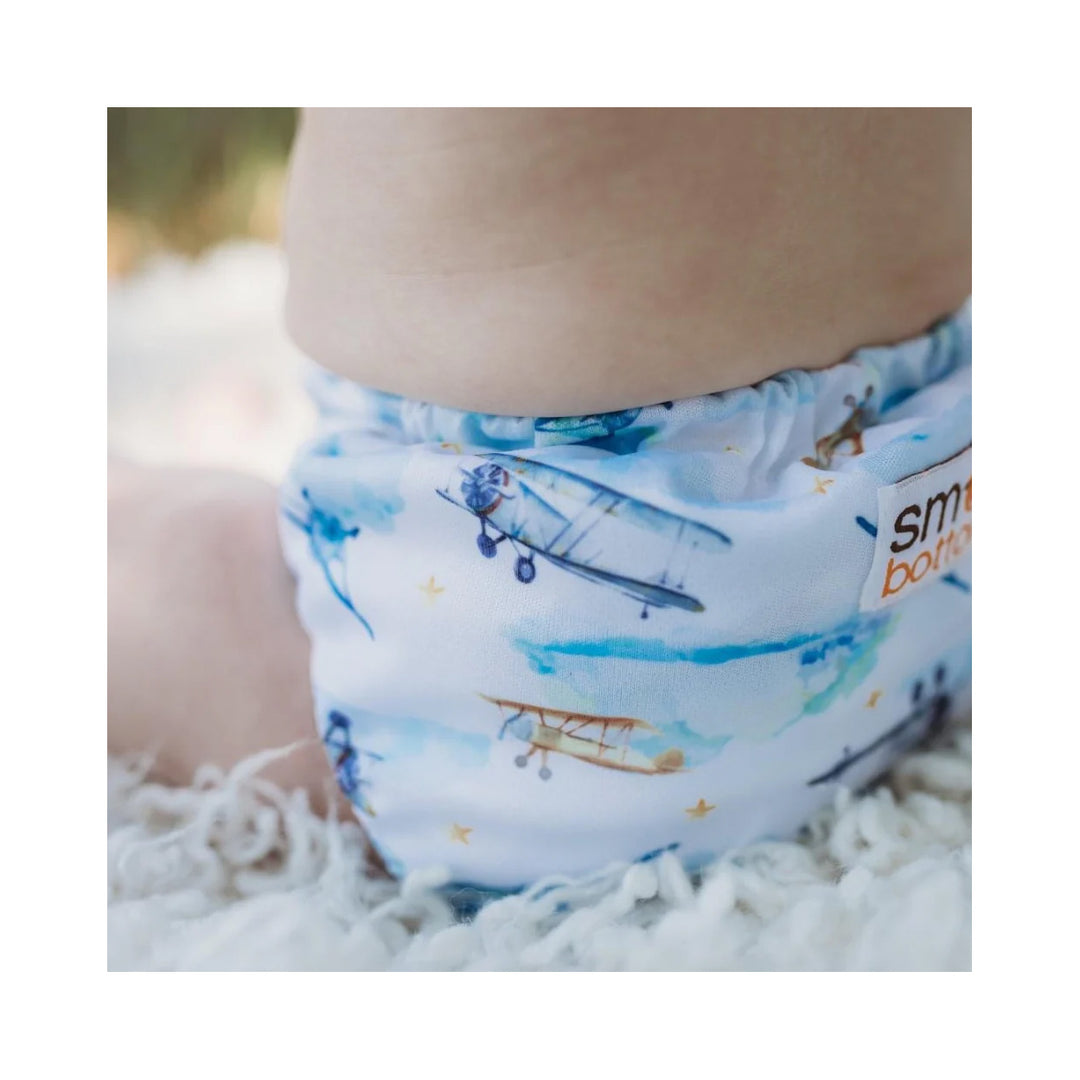 Smart Bottoms 4.0 organic cotton all in one cloth diaper first flight on a baby