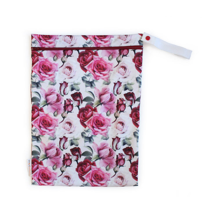 Smart Bottoms on the go wet bag for cloth diapers in Moira pink roses flower print