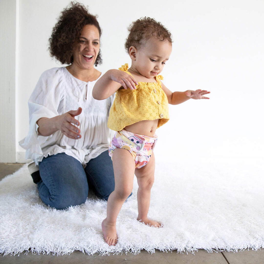 baby walking in cloth diaper