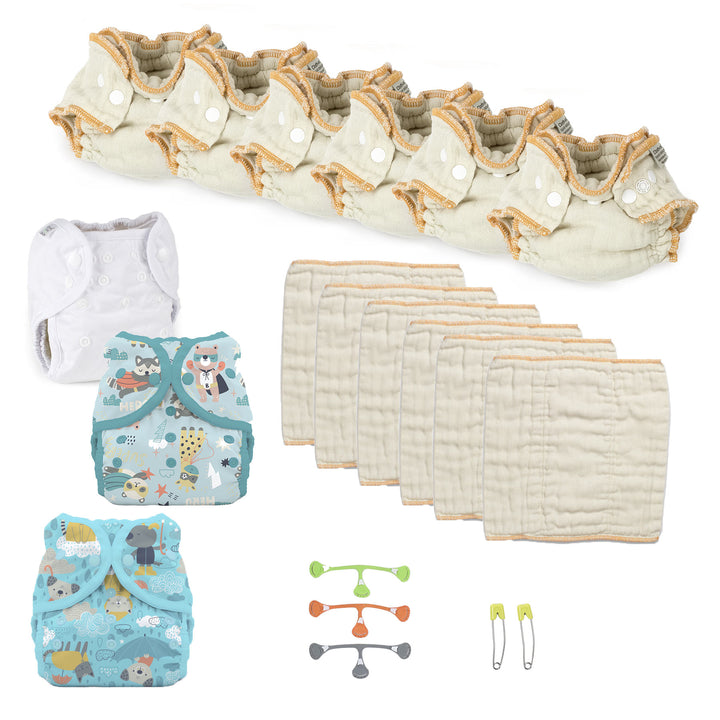 Baby cloth diaper set with diapers, cover, and accessories on a white background for a boy