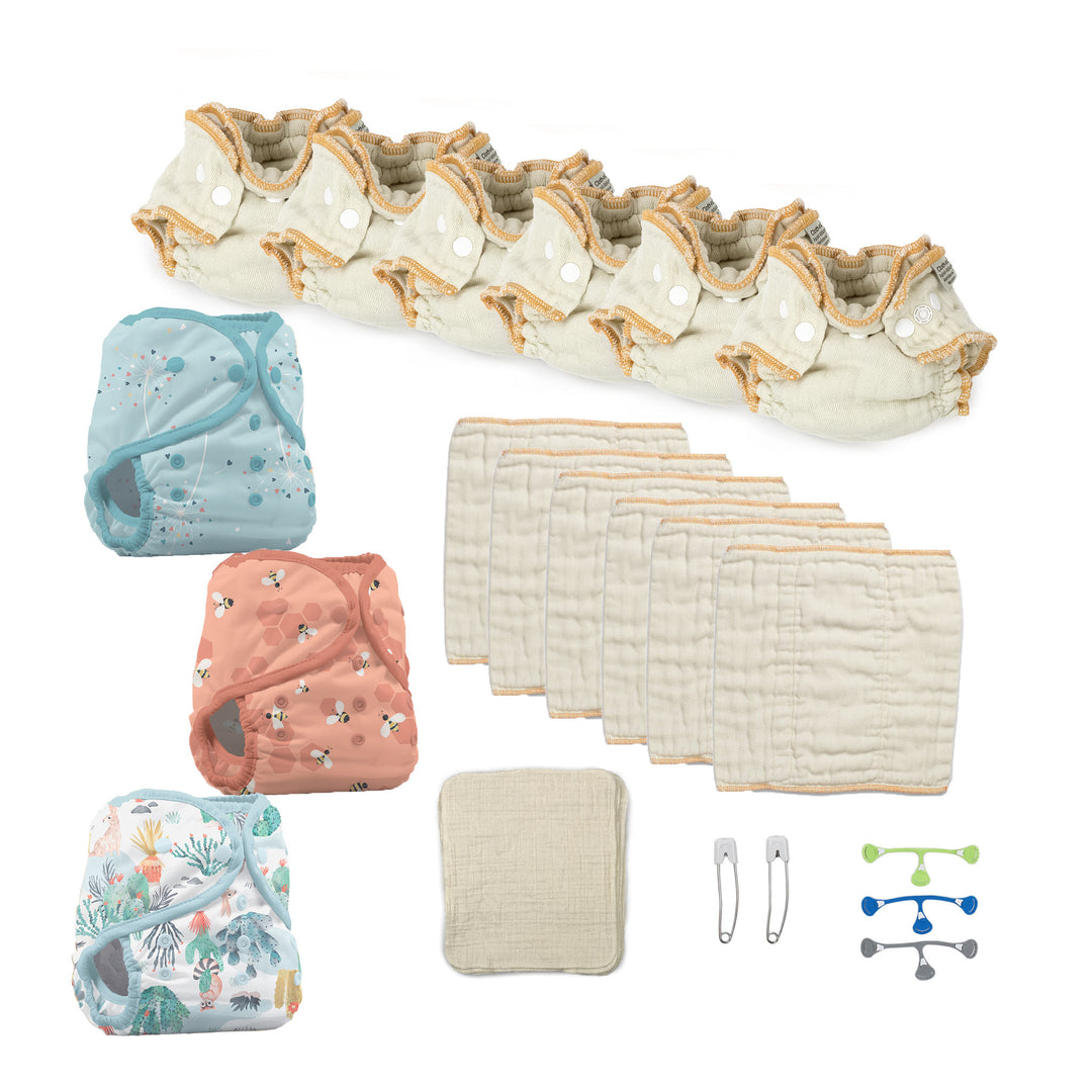newborn cloth diaper kit with diaper covers and blue snappi fastener blowing kisses, let it bee and desert dunes