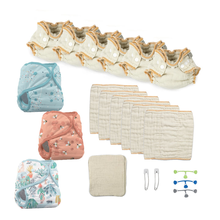 newborn cloth diaper kit with diaper covers and blue snappi fastener blowing kisses, let it bee and desert dunes