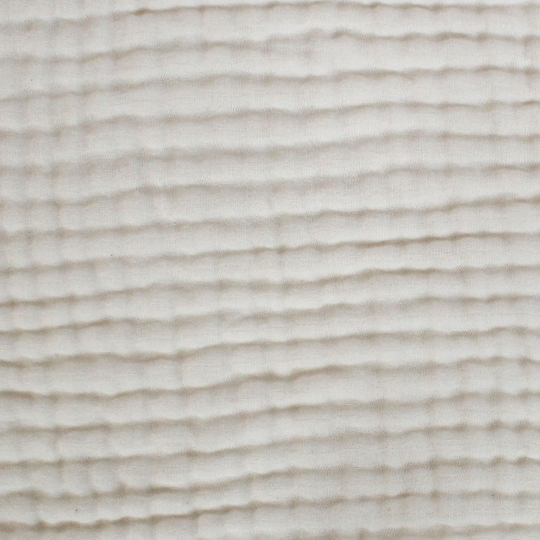 Close-up of a textured fabric with wavy lines natural organic unbleached cotton