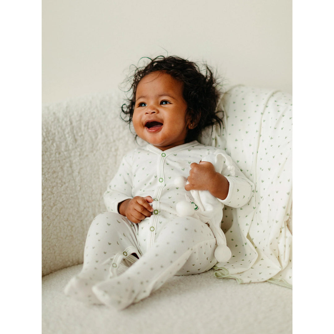 Baby in a hearts print organic cotton baby outfit