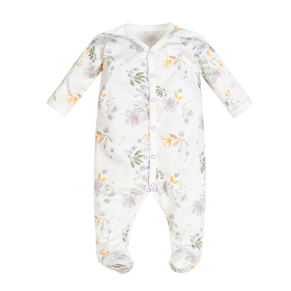 A baby footed sleeper in white with a delicate pastel floral print in purple, yellow, and green, featuring a snap-button front closure.