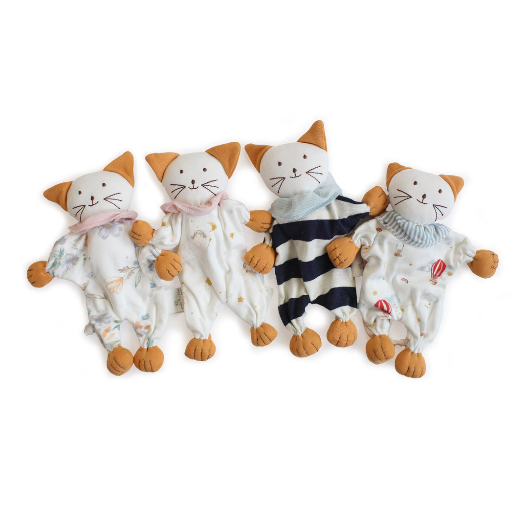 Four cat-shaped plush toys in various outfits on a white background made of organic cotton