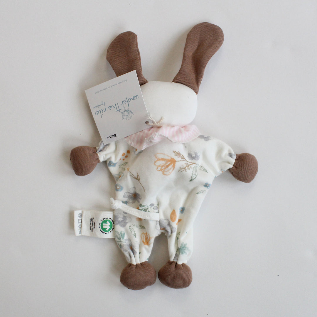 Organic baby toy puppy with tail floral pattern and brown legs on a white background