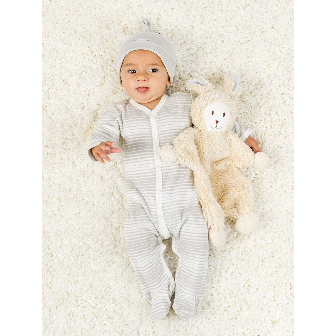 Baby lying down with Under the Nile snuggle bunny with blue stripes ears organic cotton