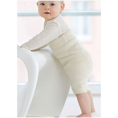 Baby standing in Ruskovilla short nappy pants wool diaper cover
