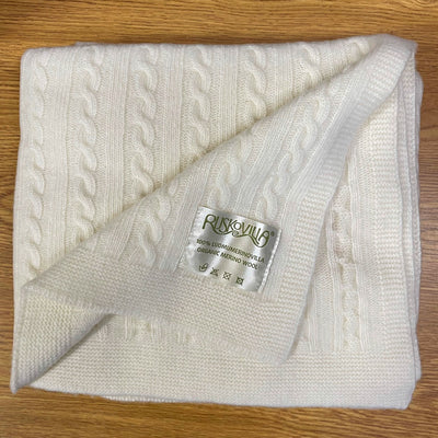 Ruskovilla organic merino wool baby blanket on a table